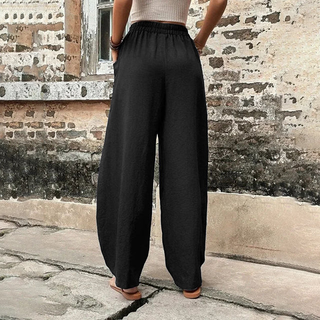 Vanna - Pantaloni fluidi a gamba larga con tasche a patta e vita elastica