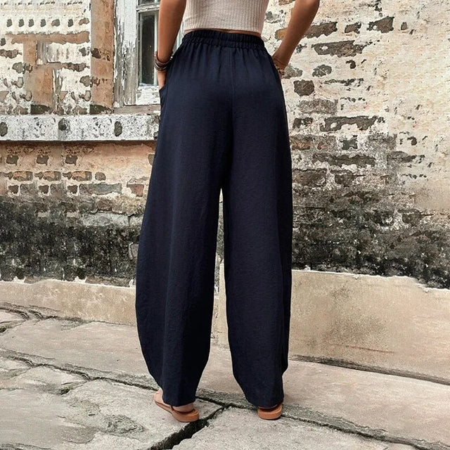 Vanna - Pantaloni fluidi a gamba larga con tasche a patta e vita elastica